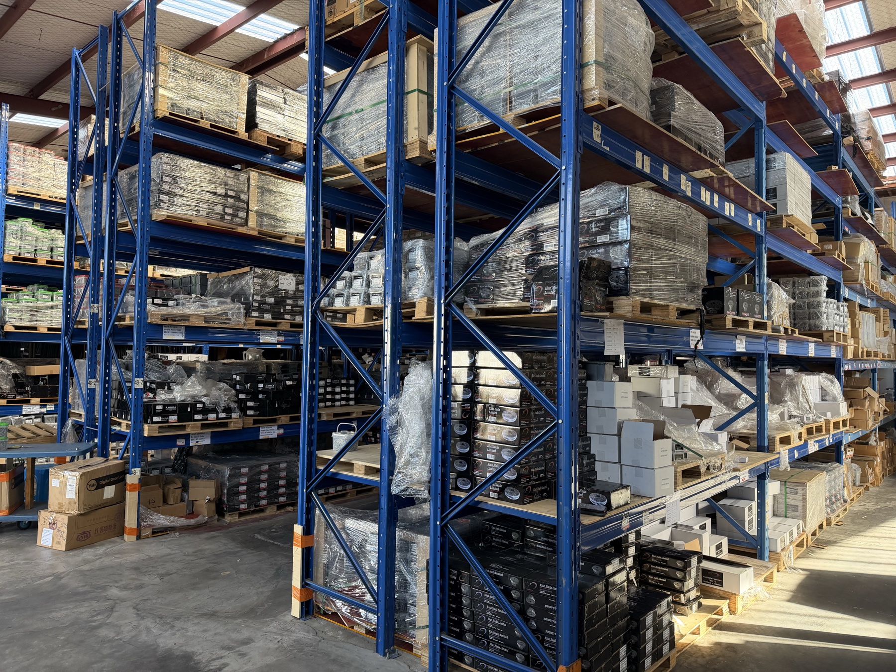 Kiwi Nails East Tamaki warehouse — main pallet-racked aisle