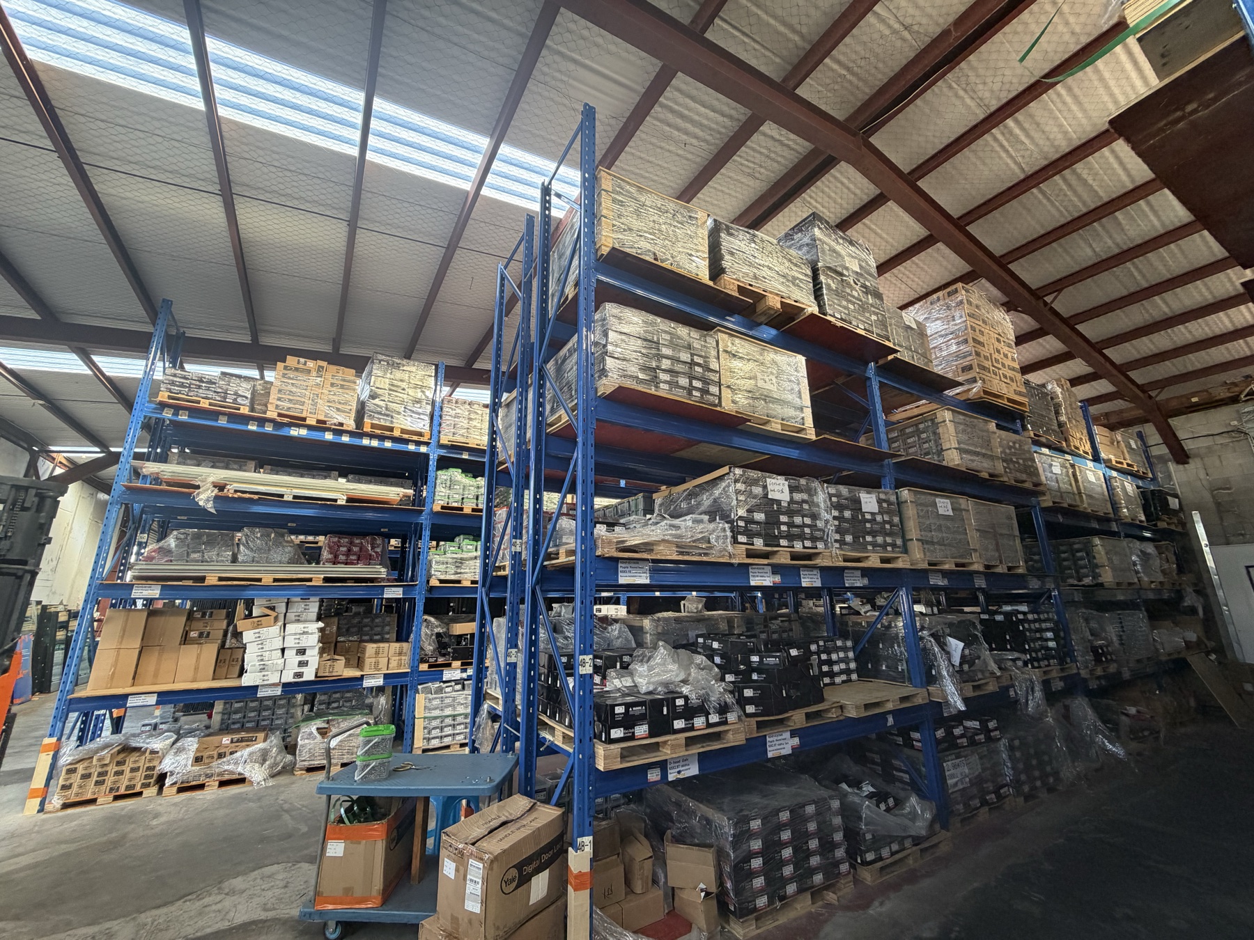 Kiwi Nails warehouse — packaged loose nail boxes on racking