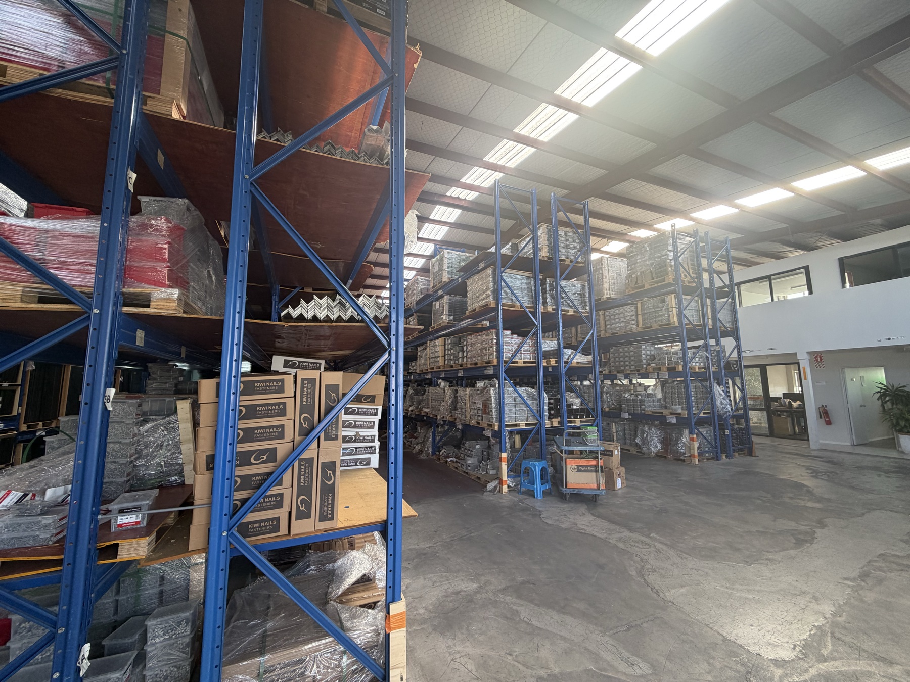 Kiwi Nails warehouse interior with office